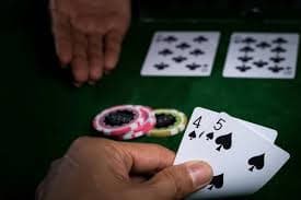 Multi-player Infinite Blackjack table on diablo showing dealer and shared community cards